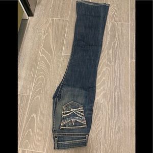 Low rise frayed jeans